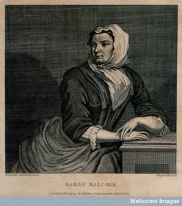 V0041240 Sarah Malcolm sitting in prison with her hands resting on a